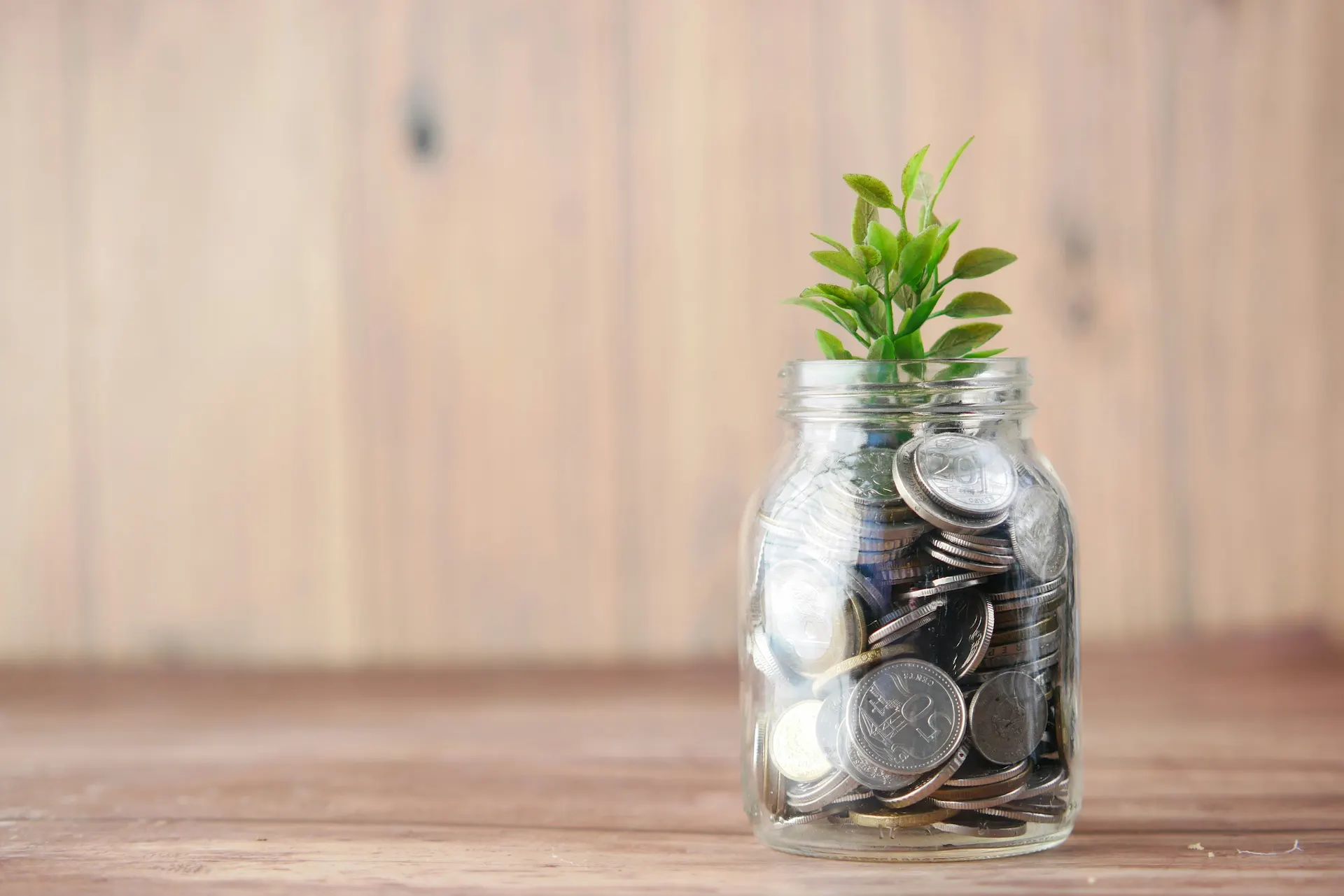 Coins in a glass jar representing structured fixed income investing